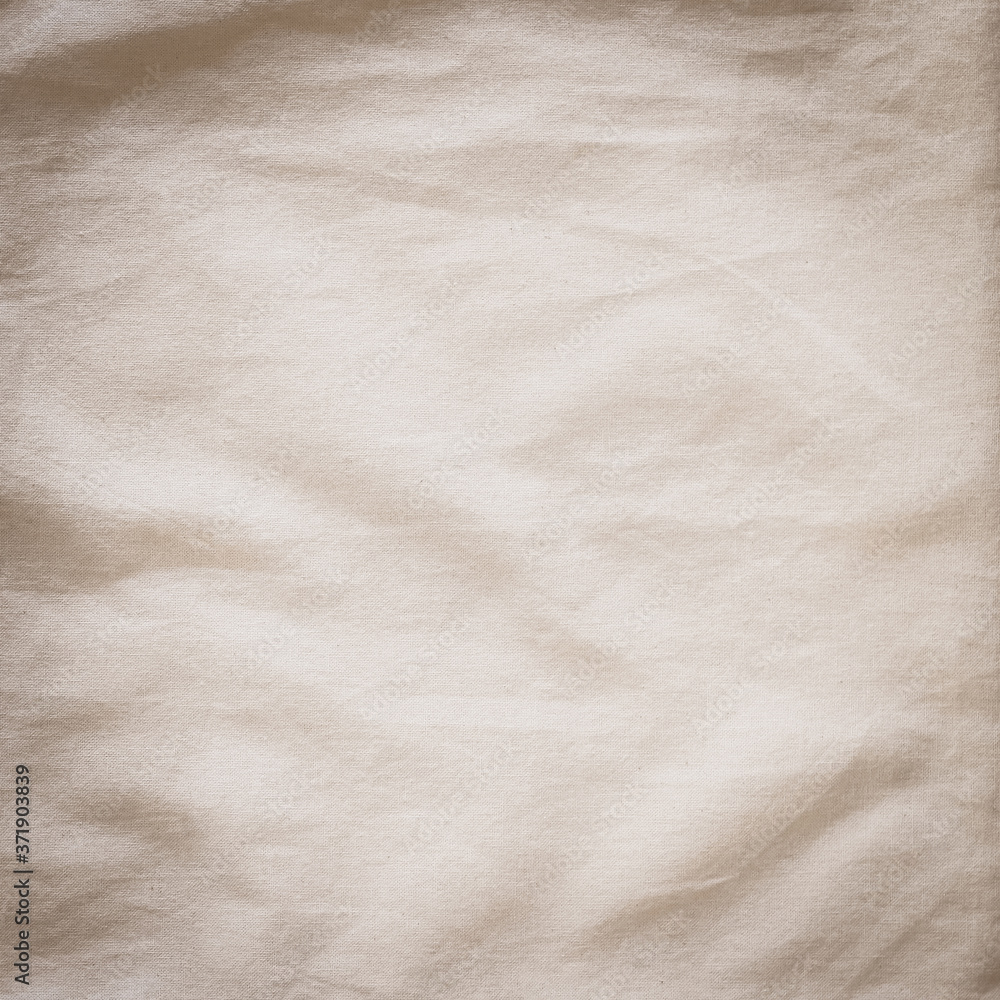 Naklejka premium Cotton muslin cloth texture background burlap natural lightweight fabric textile in old aged beige brown sepia for wallpaper and design backdrop