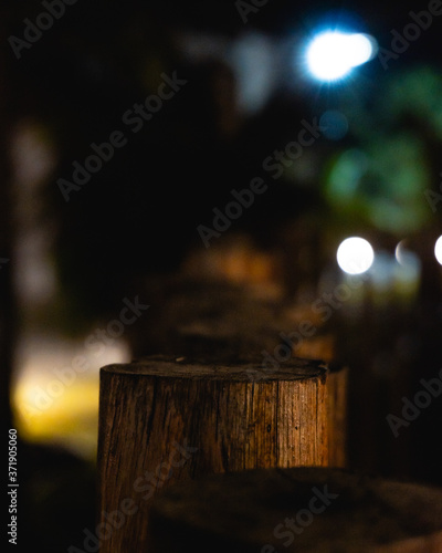 pieces of dark wood and lights over them