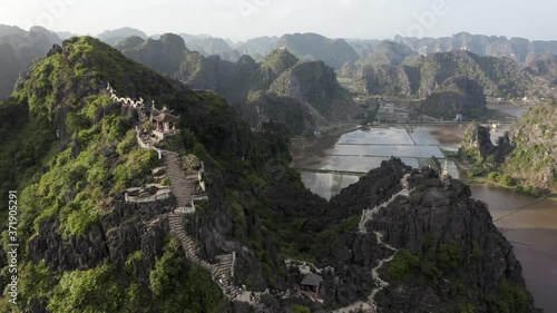 Cinematic drone flying over Hang Mua Viewpoint in Ninh Binh in Vietnam photo