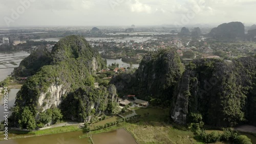 Cinematic drone shot of Tam Coc in Ninh Binh/Vietnam photo