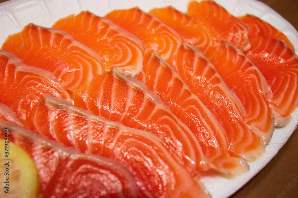 Sliced raw salmon fish, fresh salmon sashimi.