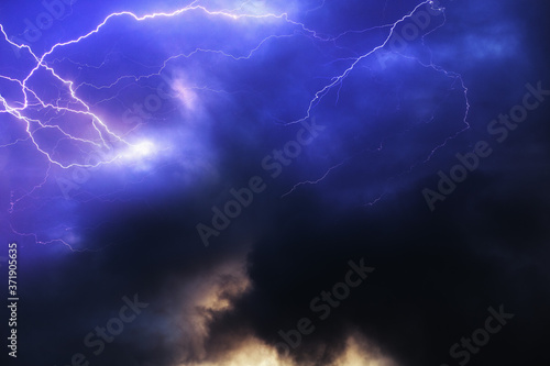 Lightning in a dark blue stormy sky