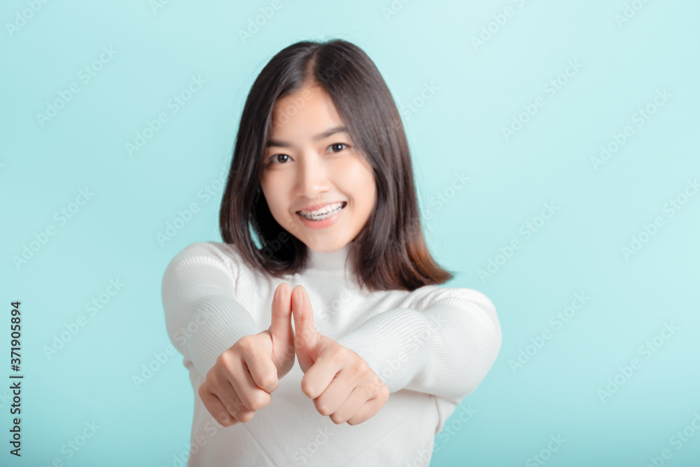 Dental braces of young asian woman wearing braces with white teeth concept. Dental braces of young asian woman wearing braces with white teeth concept.
