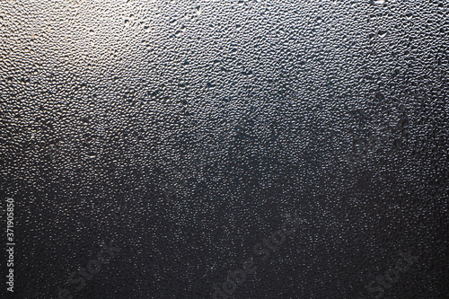Misted glass. Condensation drops on the window. Background. Texture.