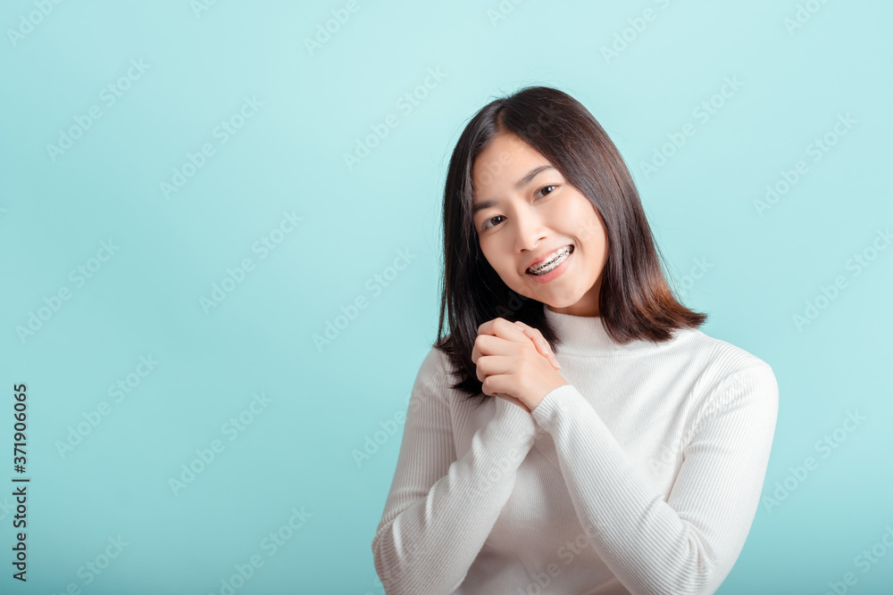 Dental braces of young asian woman wearing braces with white teeth concept. Dental braces of young asian woman wearing braces with white teeth concept.