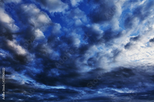 Beautiful summer blue sunset clouds. Background with a gray and blue sky for Photoshop.