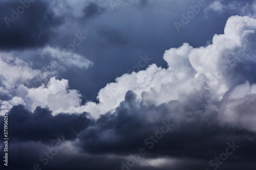 Dark thunderclouds in close-up. A background with dark clouds for design. 