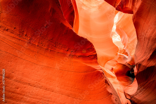 Fiery labyrinths of natural landscape in Lower Antelope Canyon in Page Arizona with bright sandstones stacked in flaky raging waves