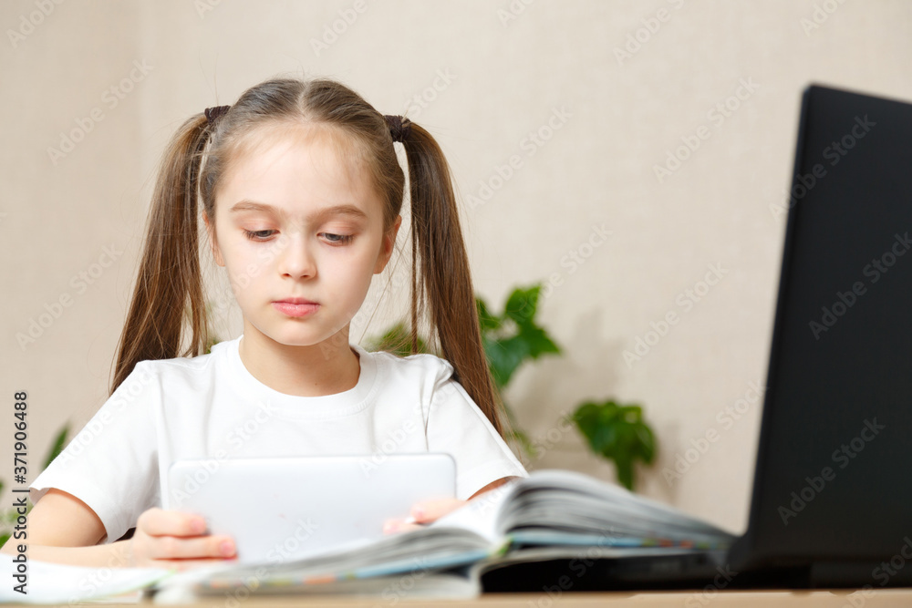Portrait of girl does her homework at home Portrait of girl does her homework at home