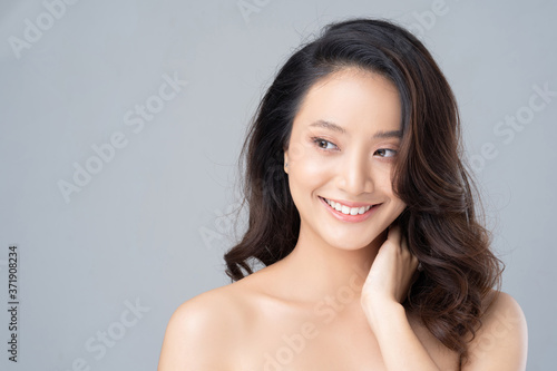 Beautiful female asian face with natural perfect skin in studio portrait