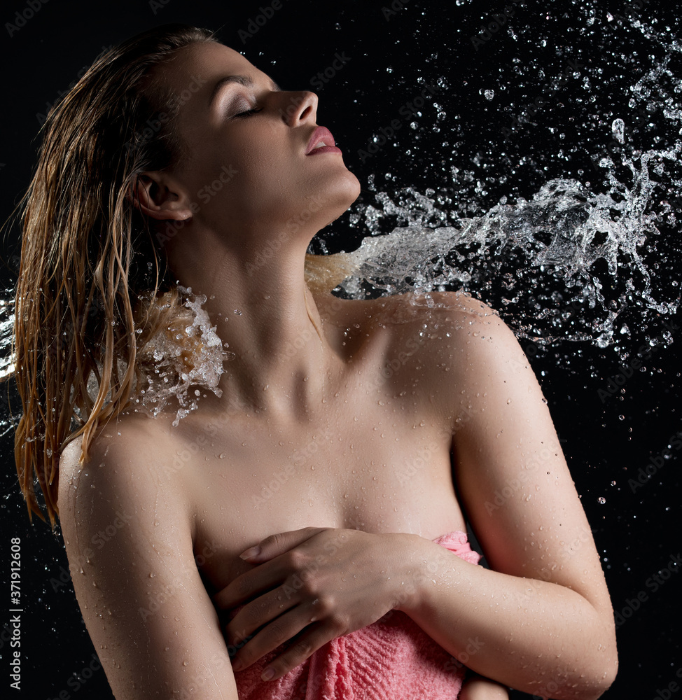 Sexy blonde enjoying water stream and splashes Sexy blonde enjoying water stream and splashes