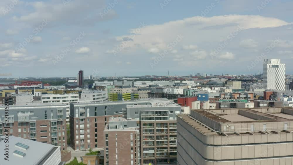 Rising aerial view between buildings in Helsinki, Finland on a sunny day. Rising aerial view between buildings in Helsinki, Finland on a sunny day.