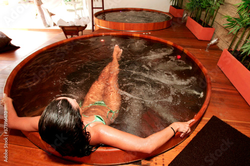 porto Seguro, bahia / brazil - january 2, 2010: Young man is seen in a hot tub in a hotal in the city of Porto Seguro, in the south of Bahia. photo