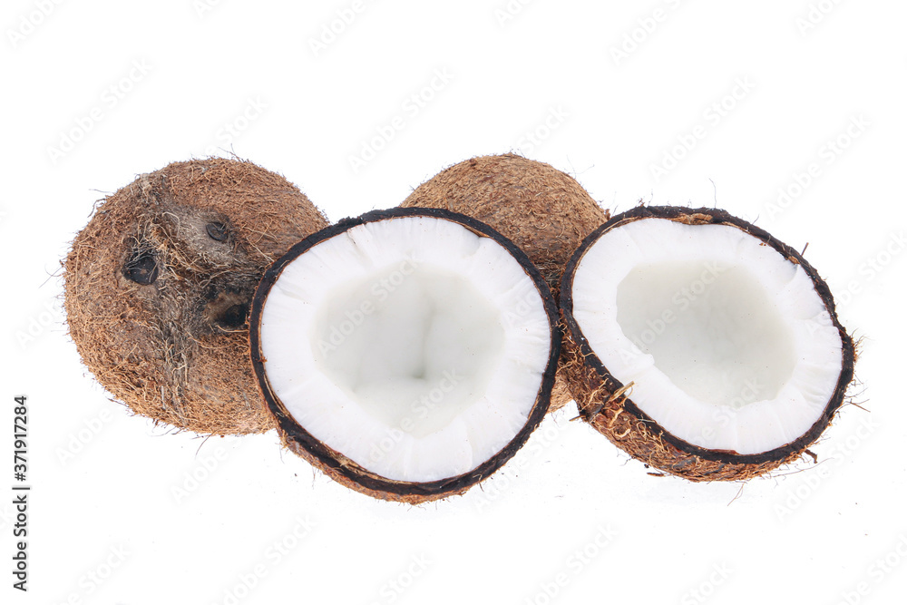 Fresh raw coconut with palm leaves isolated on white background. High resolution image Fresh raw coconut with palm leaves isolated on white background. High resolution image