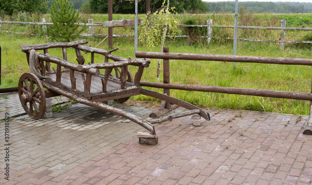 Ancient Russian wooden peasant cart for transporting hay Ancient Russian wooden peasant cart for transporting hay