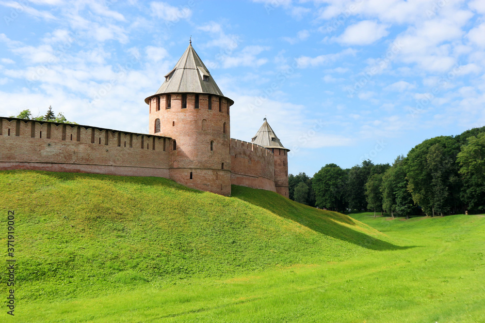 View to fedorov tower of the Velikiy (Great) Novgorod citadel (kremlin, detinets) in Russia under blue summer sky in the morning
