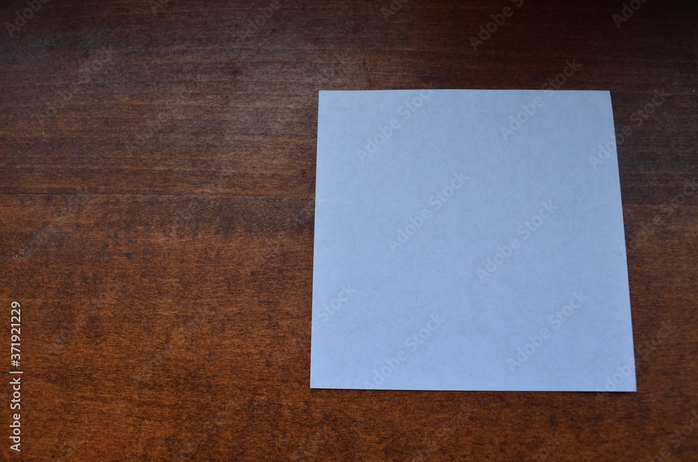 blank paper on wooden background blank paper on wooden background