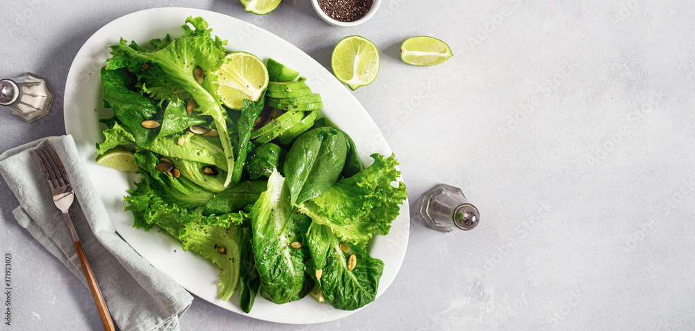 Obraz premium Healthy food concept. Diet green salad plate top view