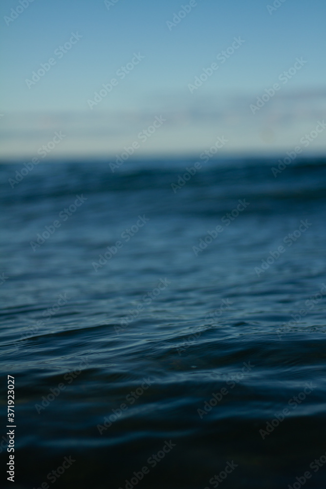 Fototapeta premium Small waves breaking on a surf beach, New Zealand. 