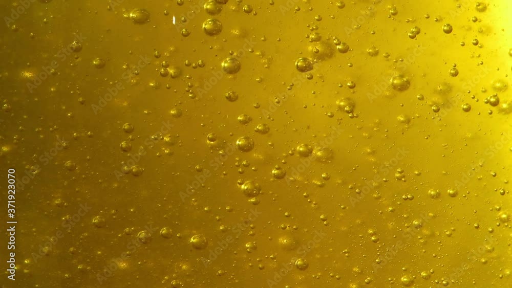 Beautiful background air bubbles slowly rise in honey Beautiful background air bubbles slowly rise in honey