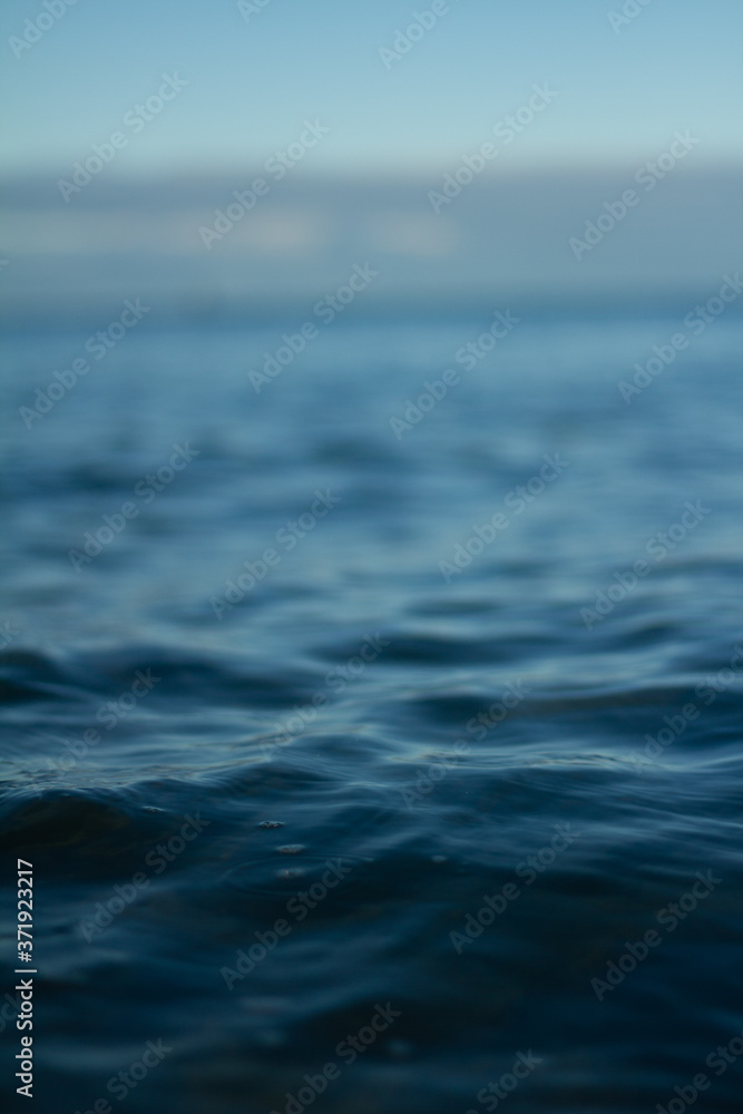 Fototapeta premium Small waves breaking on a surf beach, New Zealand. 