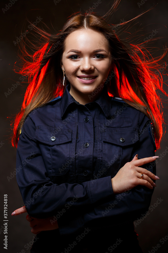 portrait of a beautiful girl in police uniform. Professional posing portrait of a beautiful girl in police uniform. Professional posing