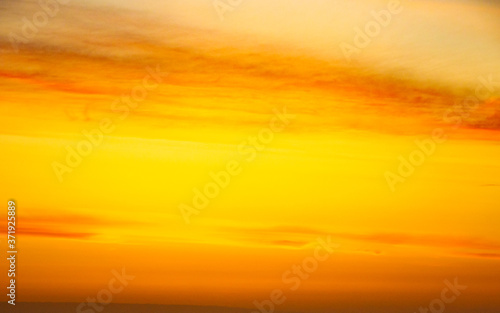 Yellow sky at sunrise or sunset