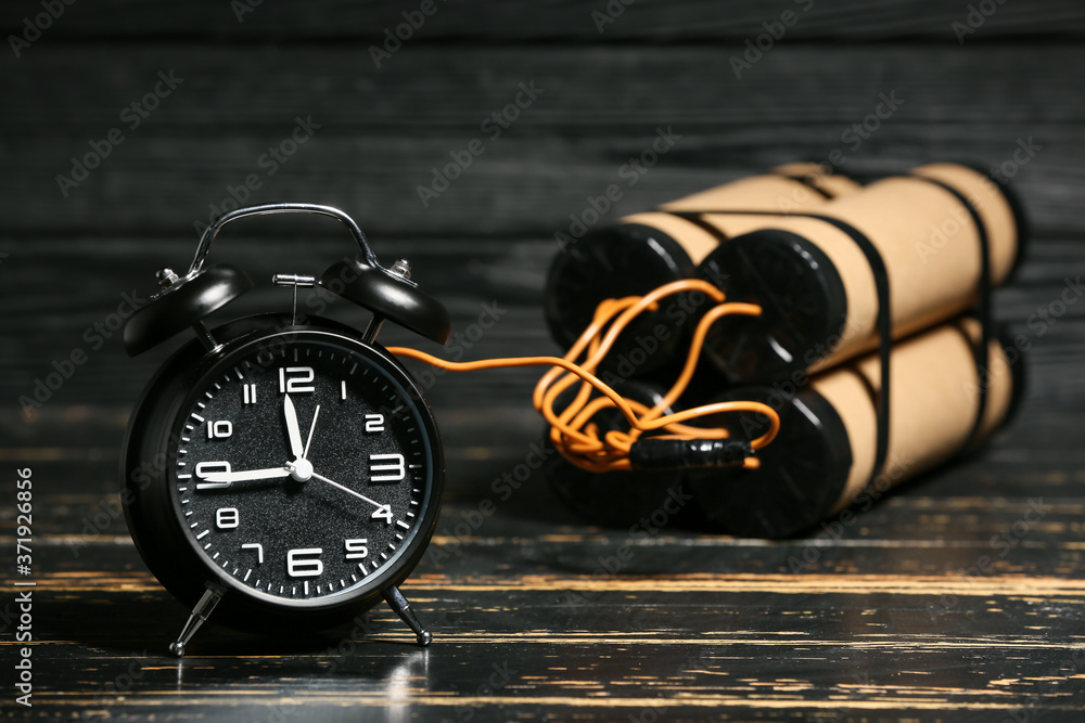 Fototapeta premium Bomb with clock timer on wooden background
