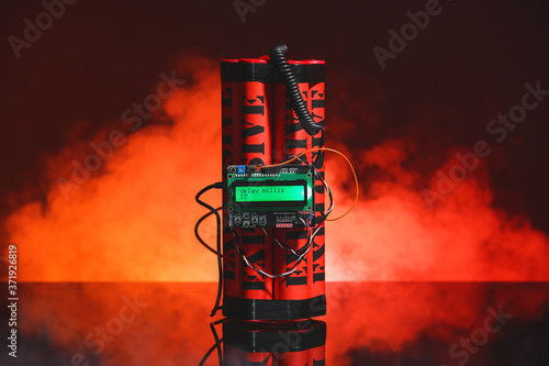 Fotografi Bomb with timer on dark color background