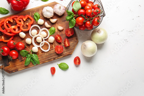 Composition with fresh cherry tomatoes, herbs and spices on table