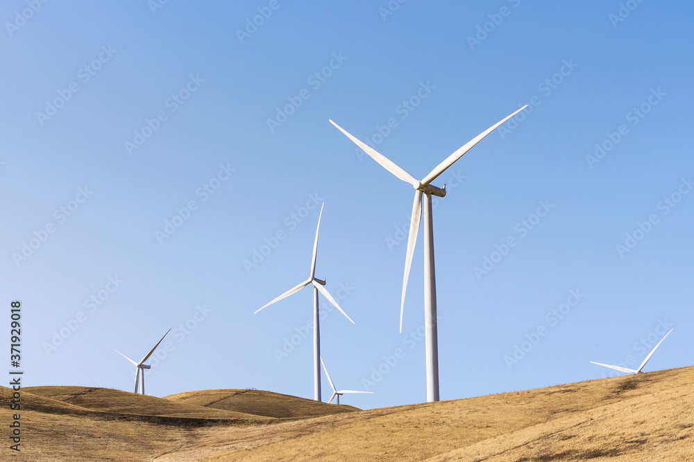 Wind turbines on the top of hills in Altamont Pass, East San Francisco bay area, California Wind turbines on the top of hills in Altamont Pass, East San Francisco bay area, California