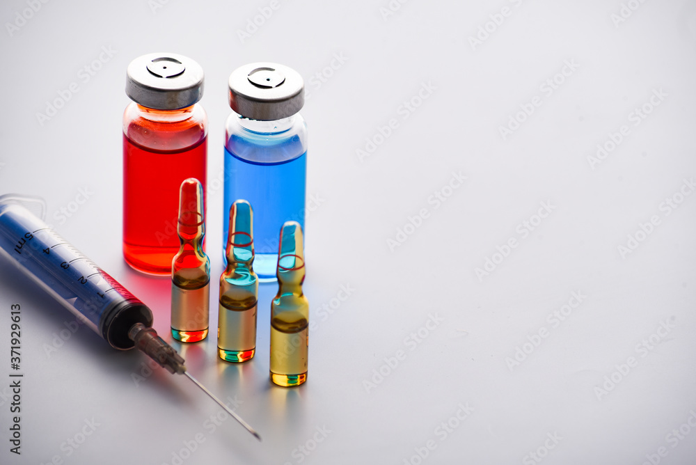 medical ampoules for injection and syringe. medicines and disease treatment. pharmacology and science medical ampoules for injection and syringe. medicines and disease treatment. pharmacology and science