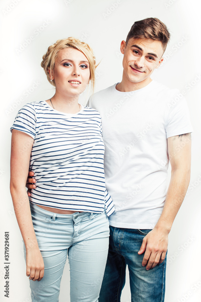young pretty teenage couple, hipster guy with his girlfriend happy smiling and hugging isolated on white background, lifestyle people concept young pretty teenage couple, hipster guy with his girlfriend happy smiling and hugging isolated on white background, lifestyle people concept