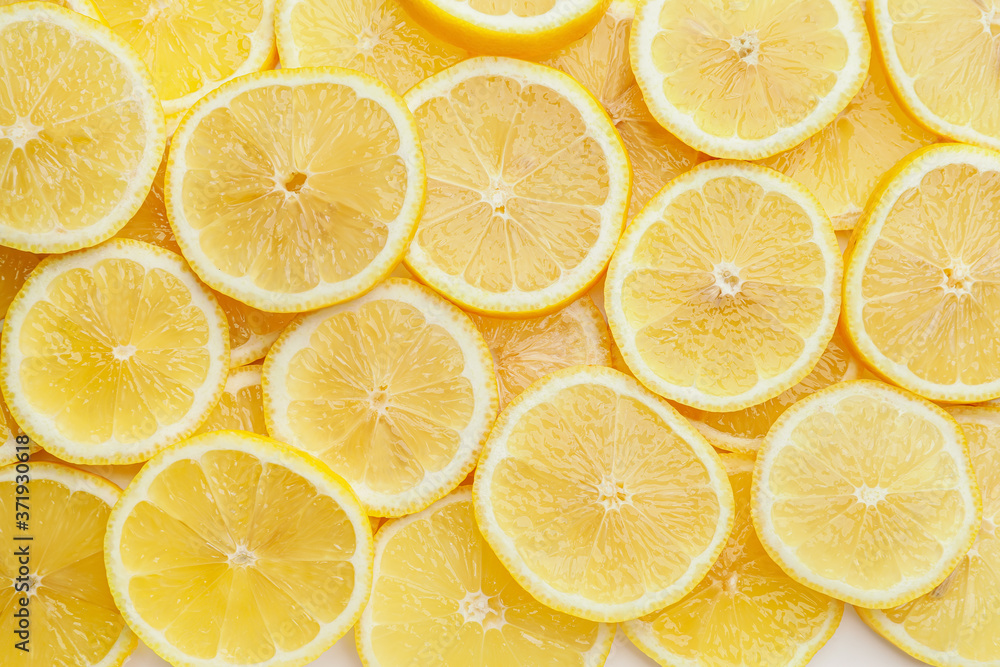 Slices of ripe lemon as background