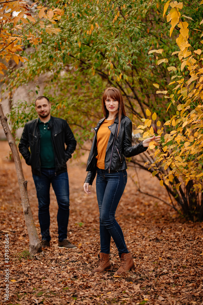 couple walking in autumn Park. romantic walk. couple walking in autumn Park. romantic walk.