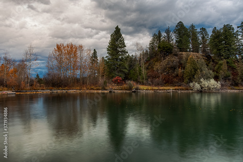 Fototapeta Naklejka Na Ścianę i Meble -  Foliage reflection in lake landscape. Flathead lake, Montana