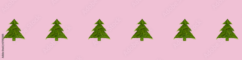 Seamless pattern with green christmas trees on a pink background. Minimal composition pattern background of Christmas trees. New year and Christmas concept. Wide format banner Seamless pattern with green christmas trees on a pink background. Minimal composition pattern background of Christmas trees. New year and Christmas concept. Wide format banner
