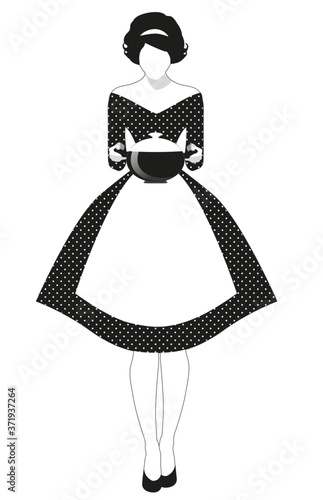 Beautiful housewife dressed in the style of the 50s in a polka dot dress, carrying a steaming pot