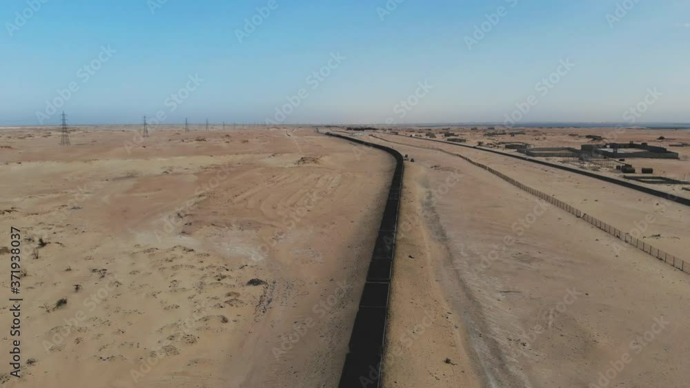 Train. Train in Mauritania. Train carrying coal. Industry in Mauritania. Filming from a drone. Footage. Mauritania in 4k. Africa in 4k Train. Train in Mauritania. Train carrying coal. Industry in Mauritania. Filming from a drone. Footage. Mauritania in 4k. Africa in 4k