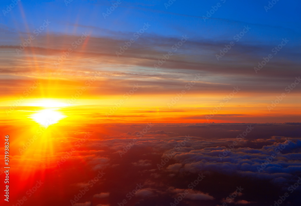 Spectacular Flying in the Twilight . Flight over the Clouds with Sunset 