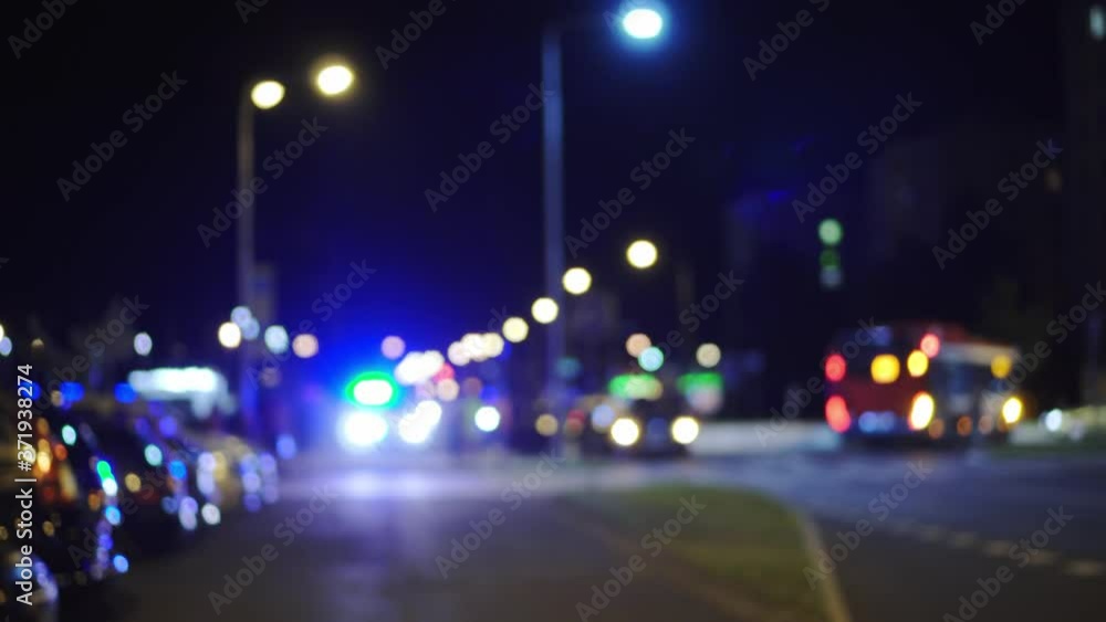 Car accident at night, blue police lights blinking on street, soft focus background, great web cover Car accident at night, blue police lights blinking on street, soft focus background, great web cover