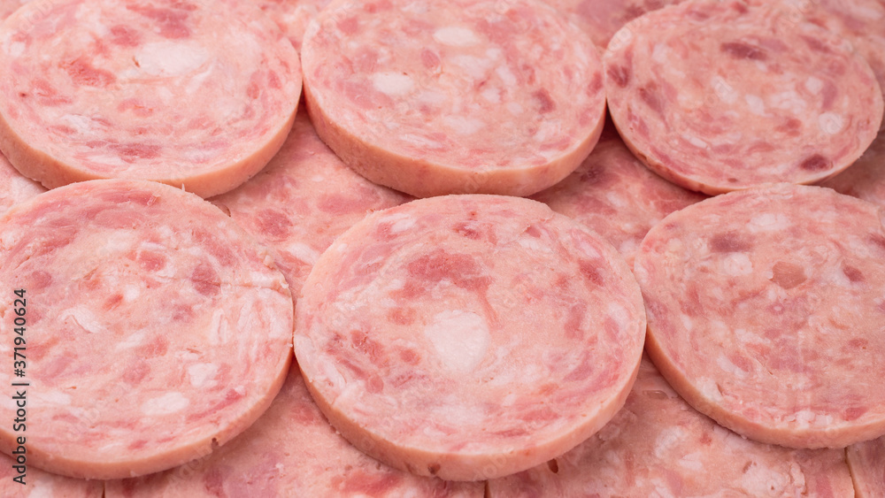 Boiled sausage isolated on white background. Slices. Boiled sausage isolated on white background. Slices.