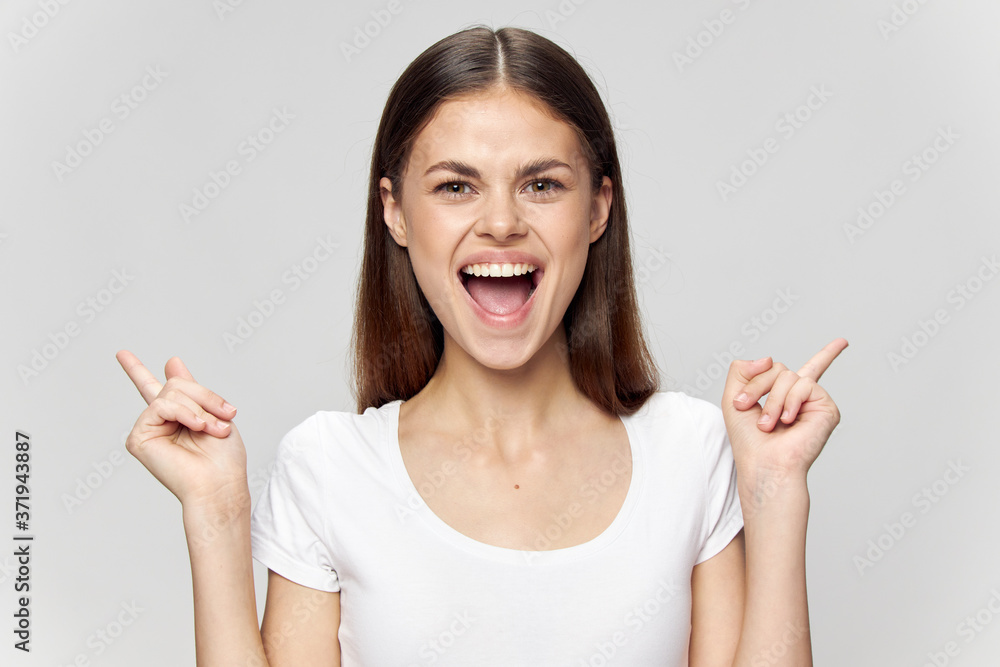 brunette with wide open mouth shows thumb up on isolated background Copy Space brunette with wide open mouth shows thumb up on isolated background Copy Space