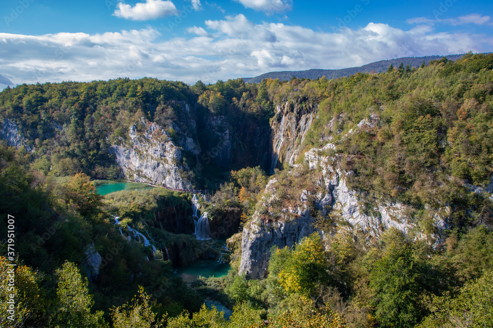 Incredible, huge waterfalls in the beautiful, famous Plitvice Lakes, Croatia during bright, sunny summer day Incredible, huge waterfalls in the beautiful, famous Plitvice Lakes, Croatia during bright, sunny summer day