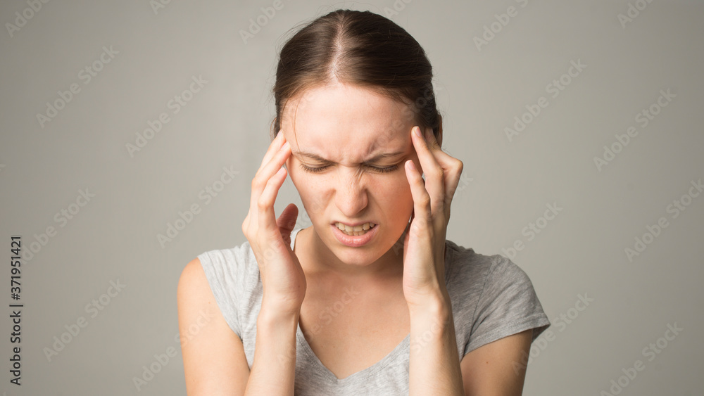 Tired woman feeling neck pain Tired woman feeling neck pain