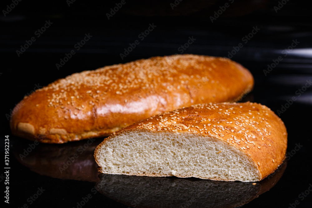 Homemade pastries. Crispy white bread cut with a knife. Homemade pastries. Crispy white bread cut with a knife.
