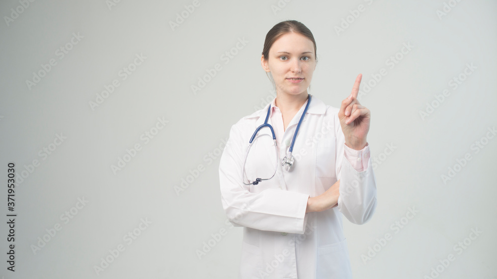 Portrait of an attractive young female doctor in white coat. Portrait of an attractive young female doctor in white coat.