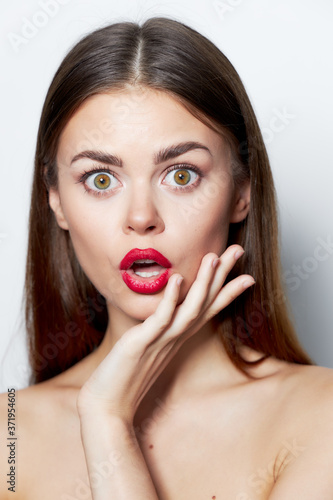 Brunette spa treatments Surprised look naked shoulders red lips light