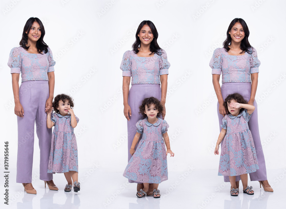 Asian Mother Caucasian Daughter Little girl hold mom hand and smile with love