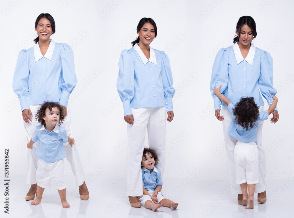 Asian Mother Caucasian Daughter Little girl hold mom hand and smile with love Asian Mother Caucasian Daughter Little girl hold mom hand and smile with love